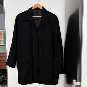 Black Textured light Coat or blazer.